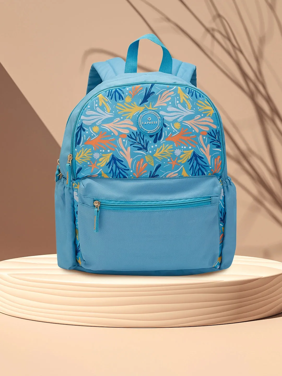 Caprese Xenia Backpack Medium Dual Compartment Light Blue Printed